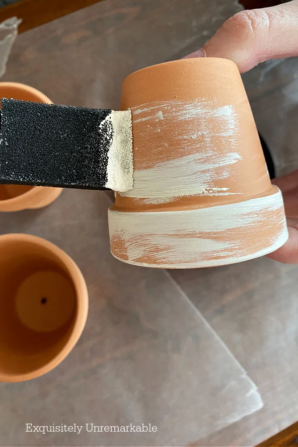Painting Mini Clay Pots with a foam brush and white chalk paint