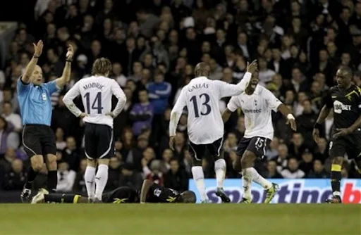 Bolton player Fabrice Muamba lies on the pitch after collapsing during a game against Tottenham