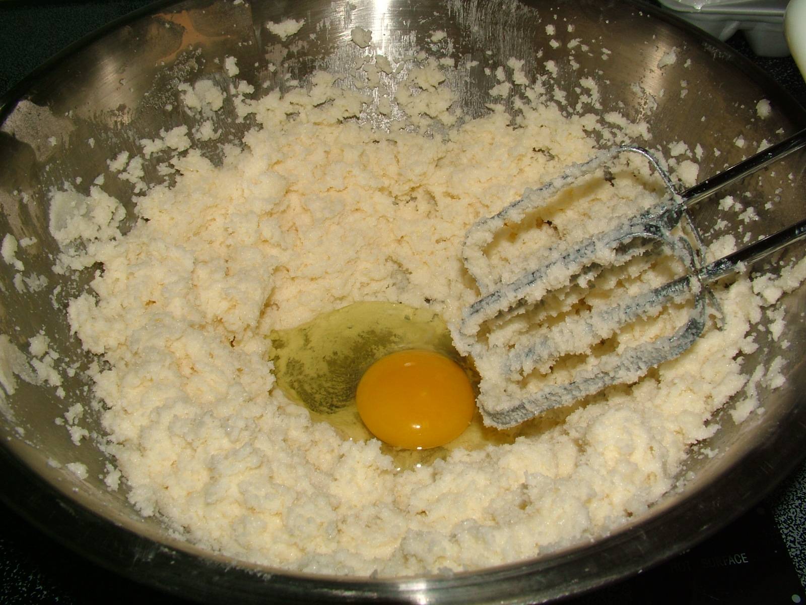 Once the butter is creamed, add the eggs one at a time, mixing well ...