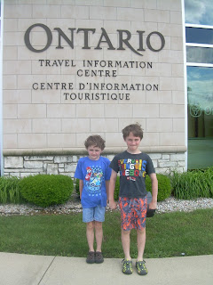 The boys in front of the Ontario travel information centre.