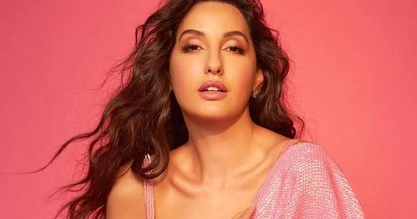 nora fatehi pink saree