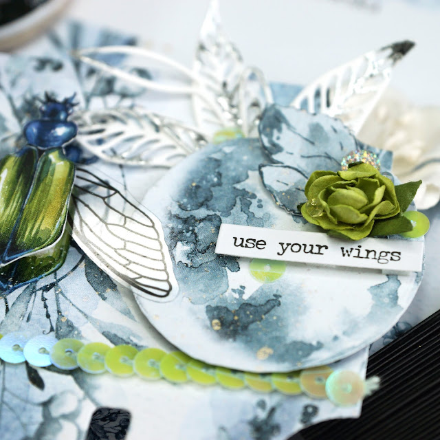 Memorydex Use Your Wings beetle card using the P13 New Moon collection; with fussy cut ephemera, Prima opal magic paint, Reneabouquets beautiful beads in moonstone, Tim Holtz transparent wings, funky floral and skeleton leaves die cuts and Heidi Swapp silver Minc foil