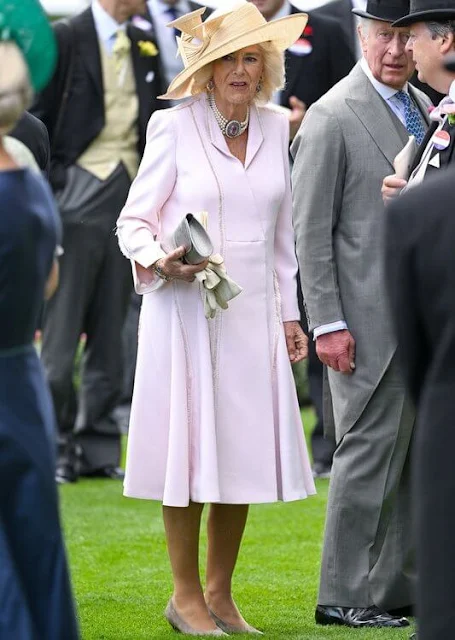 Zara Tindall wore a blue dress by Laura Green. Queen Camilla wore her Anna Valentine pink dress coat. Suzannah Allison dress