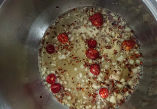 ginger garlic and red chilli frying in oil