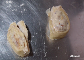 Pudding rolls cut off and placed on the buttered baking tray