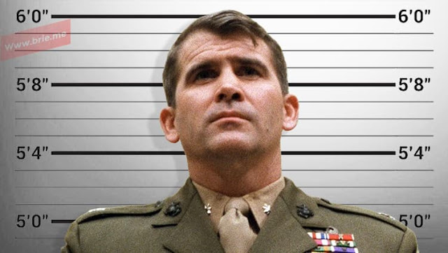 Oliver North standing tall and proud in front of a height chart background