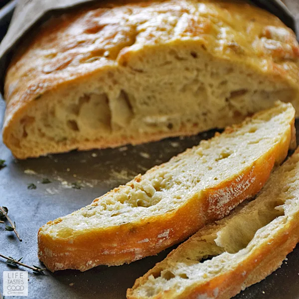 Crusty Artisan Style Bread | by Life Tastes Good has a wonderfully tangy flavor with a crispy outside and soft, chewy inside. With this no-knead recipe, it's easy to craft homemade bread just like the bakery! Makes a lovely hostess gift with a bottle of wine, and it's perfect for Thanksgiving! #LTGrecipes