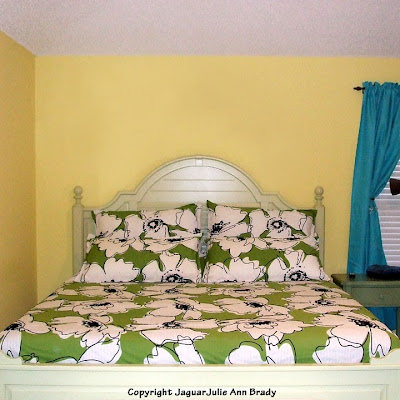 Green White and Black Floral Bedding in Master Bedroom