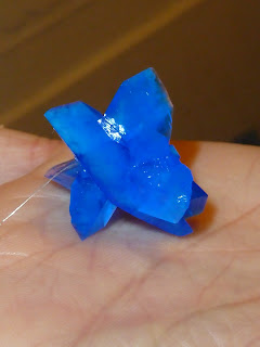 Copper sulphate crystal with nylon string attached