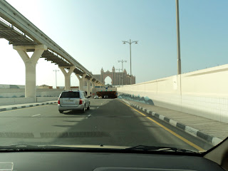 Taxi drive to Palm Jumeirah, Dubai. The Atlantis Hotel in the distance.