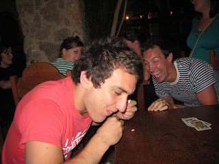 Matt laughing as Adam chokes on his sandwich racing to finish first.