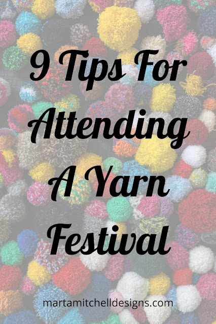 Text: 9 Tips For Attending A Yarn Festival, on top of a blurred background of wool pompoms