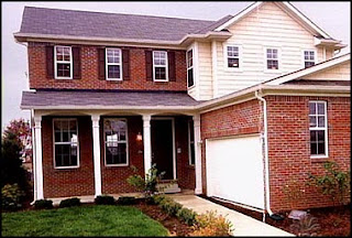 funny photo of house with a carport or garage without a driveway just a landscaped front yard