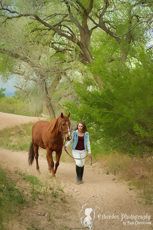 professional photo of a high school senior and her horse in Corrales