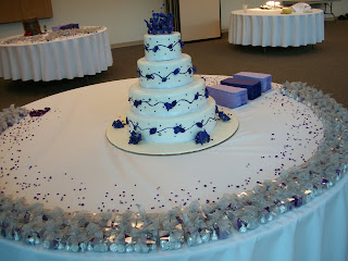The wedding cake, surrounded by confetti