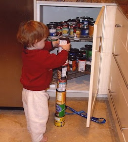 Autism Spectrum Disorders (ASD): Autistic boy obsessively stacking cans
