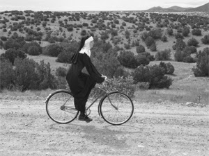 nun on bike