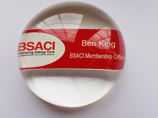 Domed resin paperweight containing an employee name badge