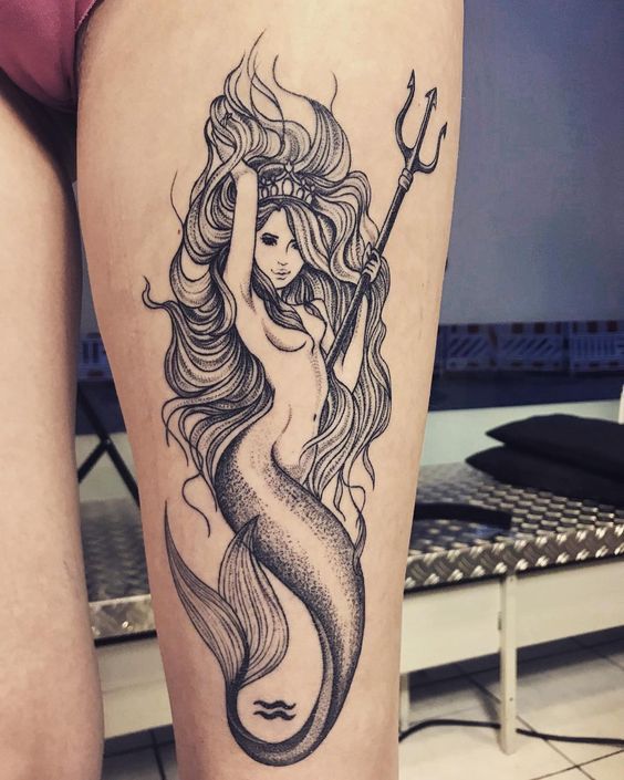 mermaid-with-trident-thigh-tattoo