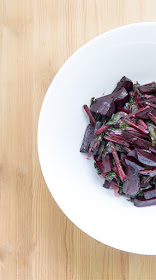 Young beet with leaves in warm salad top