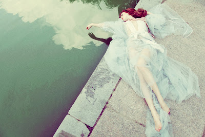 jamie nelson, fashion and beauty photographer nyc, woman laying near lake, sheer blue gown