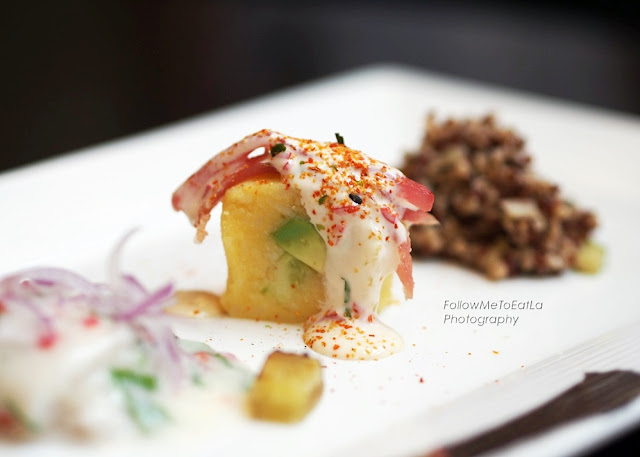 Maki-Shaped Causa filled with Avocado, Cucumber, topped with Tuna in Acevichada Sauce