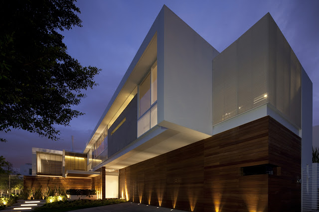 Lighted modern facade of FF House in Mexico