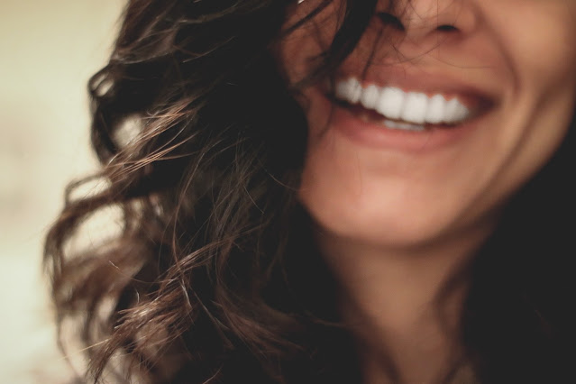 Image of a black haired woman smiling