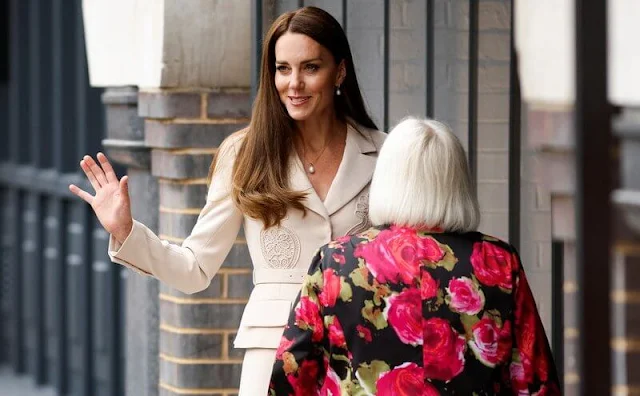 Kate Middleton wore a new lace detail crepe belted midi dress by Self Portrait. Annoushka drop earrings