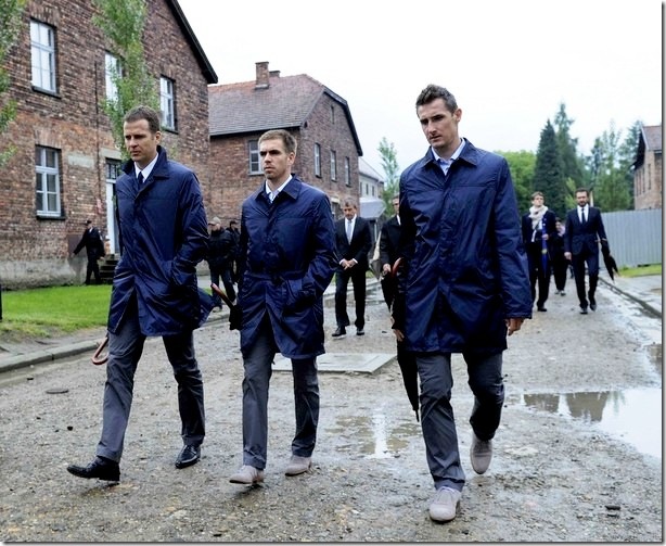 Germany's national soccer team manager Oliver Bierhoff, captain Philipp Lahm and forward Miroslav Klose (L-R) walk through Auschwitz former concentration camp during a visit by a delegation of the German Footbal Federation  (DFB), in Auschwitz June 1, 2012. The DFB delegation made the visit on Friday ahead of the Euro 2012 tournament which is being held in Poland and Ukraine from June 8.  REUTERS/Markus Gilliar/Pool   (POLAND)<br /> - Tags: POLITICS SPORT SOCCER)