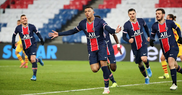 Kylian Mbappe celebrating after scoring for PSG against Barcelona