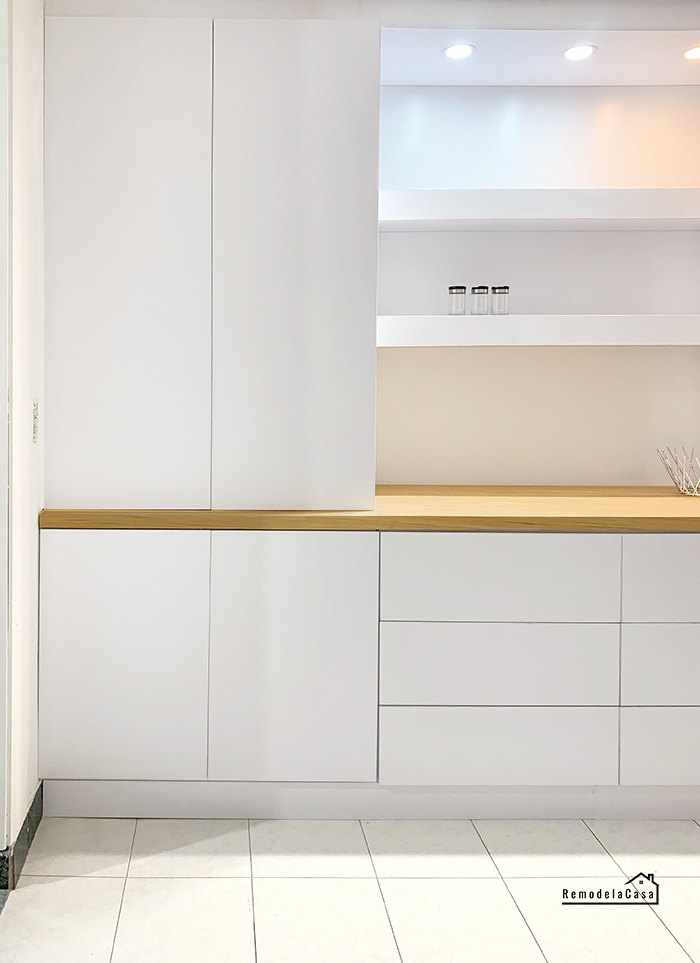 White built-in unit in dining room with floating shelves