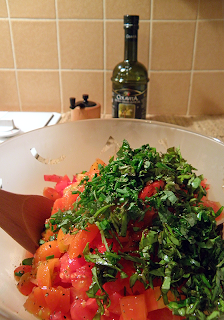 Bowl of Tomatoes Topped with Herbs and Garlic