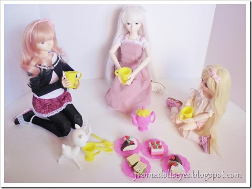 The two ball jointed dolls, the smaller doll and the deer doll all sitting down to have some tea and snacks.