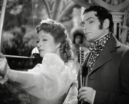 Greer Garson and Laurence Olivier using a bow and arrow in the 1940 Pride and Prejudice.