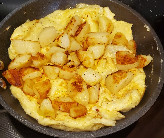 this is potatoes fried on top of an egg omelet