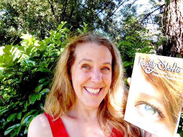 Cynthia Sue Larson with her book.