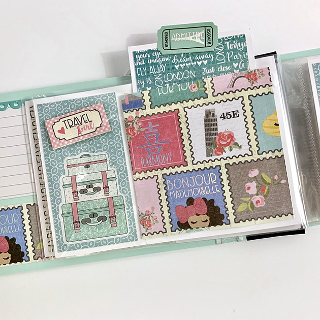 Travel Girls Scrapbook mini album with stamps, flowers, and luggage