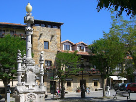 Modernist white fountain in Comillas