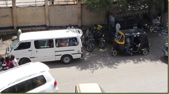 Bus stop - rickshaw and bus