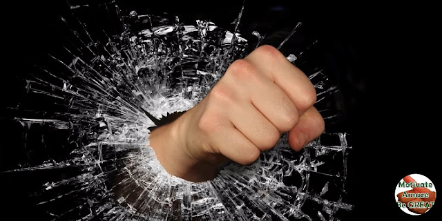 Featured image in the article: "38 Words Of Encouragement And Strength For Tough Times" - A selection of the best quotes and words of wisdom about encouragement and strength when things get hard in life. Fist breaking glass.
