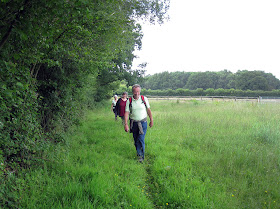 The group having just emerged from someone's garden, east of Biggin Hill.  The actual stile is just behind me.  Ups and Downs walk led by Ewa Prokop, 21 June 2011.