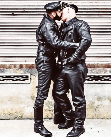 Full view of two Leatherman wearing all black leather gear kissing