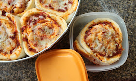 Food Lust People Love: Imagine a soft dough, shaped like cinnamon rolls, but savory, baked up with pizza sauce and mozzarella. Madam Wong's Pizza rolls are delicious and portable. Perfect in a lunchbox!