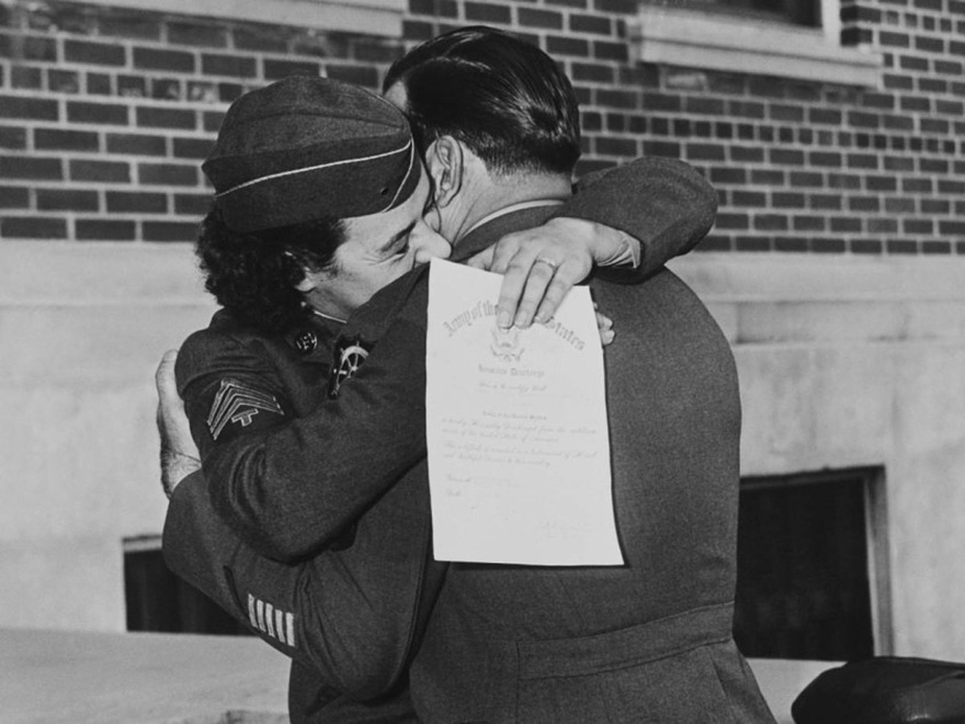 60 + 1 Heart-Warming Historical Pictures That Illustrate Love During War - Women’s Army Corp Member Kissing Her Husband, Upon Discharge January 1, 1945