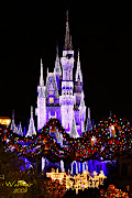 The Magic Kingdom. This picture was shot during the Spectro Magic Parade on . (disney castle parade night)
