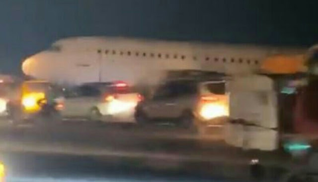 Alt: = "damaged plane along Agege Road in Lagos"