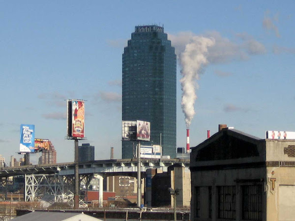 Citicorp Queens in Shadow - In a cloud's shadow, with power plant exhaust in the distance; from the Greenpoint Ave. bridge.