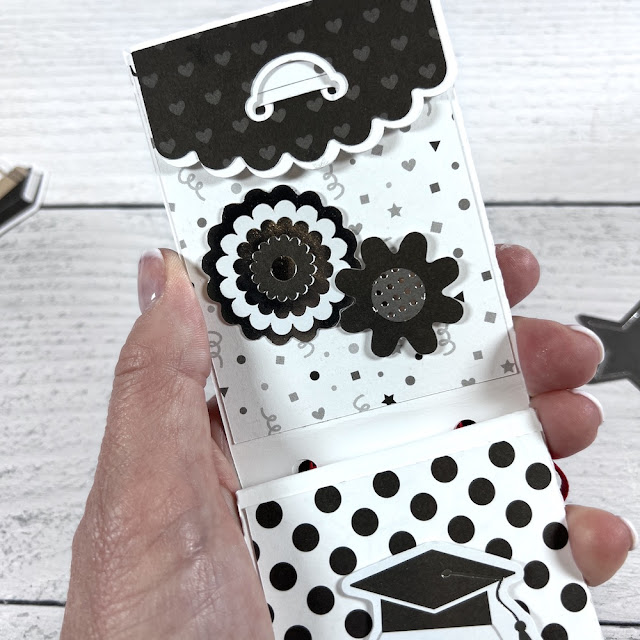Graduation gift card holder with pockets, a cap, flowers, and polka dots