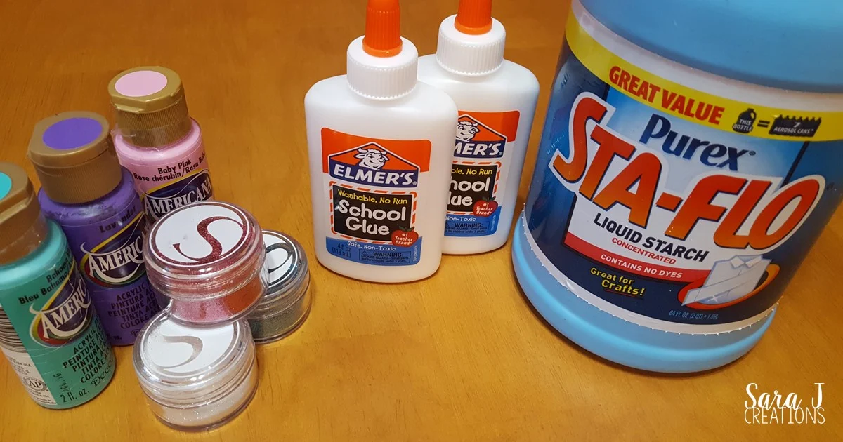 Troll inspired slime recipe.  Make your own homemade slime with troll colors and glitter for an extra sparkle.